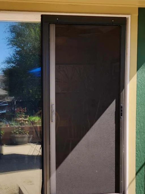 Before: Worn screen door to a new slider