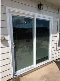 After: Blinds-between-glass slider to a clear new door
